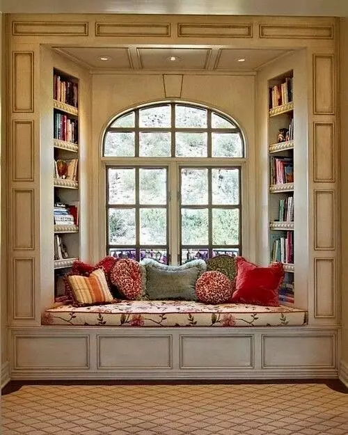 Cozy corner in a small apartment Place for leisure and reading at the window Window sofa sofa photo