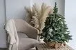 Como atopar un lugar para a árbore de Nadal nun pequeno apartamento: 6 solucións para os propietarios