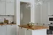 Біла кухня з дерев'яною стільницею (42 фото)