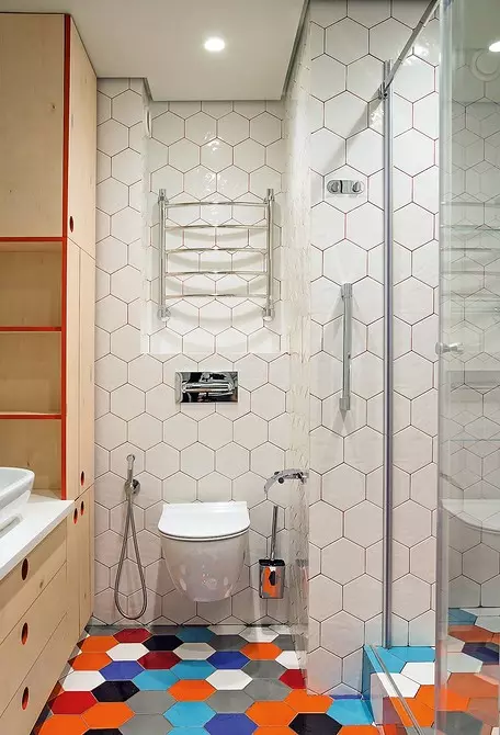 Cheerful interior bathroom with multicolored tiles and red grout 9744_8